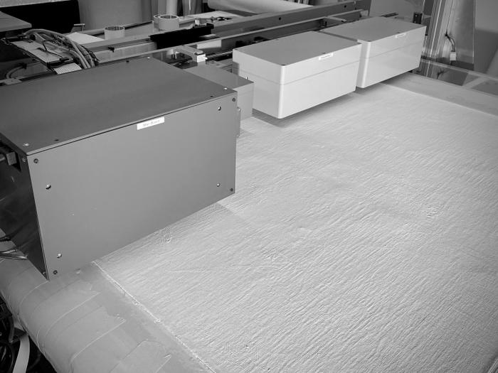 <p>A flatbed inkjet printer begins to apply colour to a gesso texture - Photo: Nick Walkley </p>