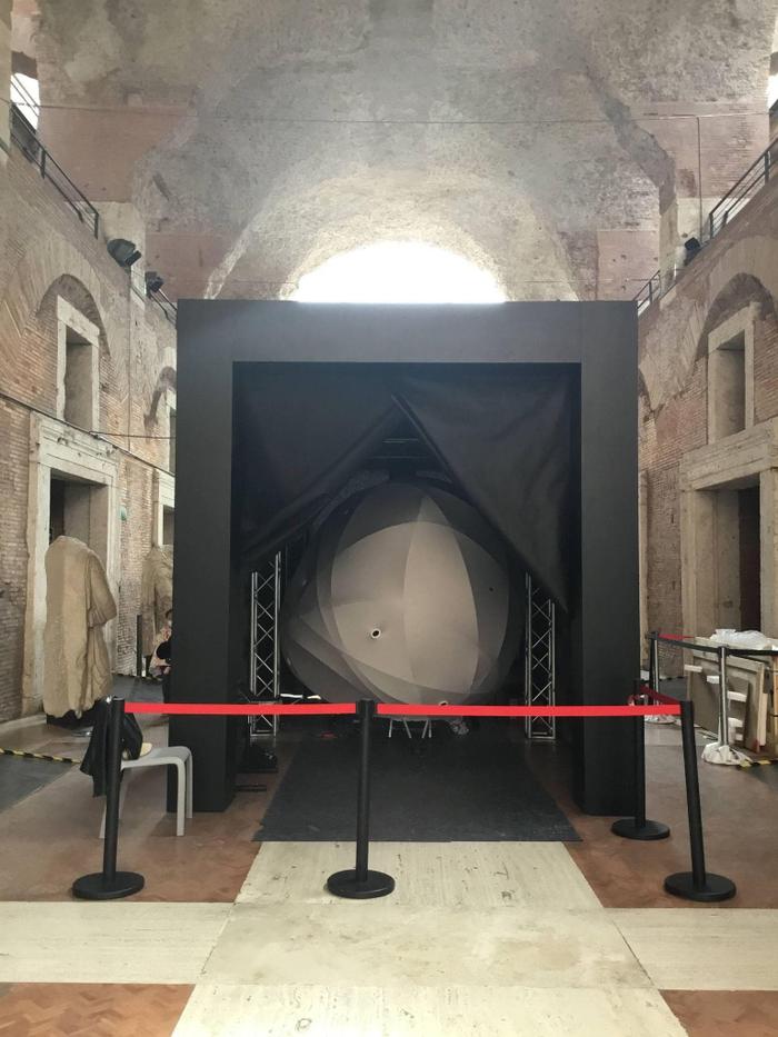 <p>Figs. 4 and 5. Inner and exterior views of <em>Synesthesia</em>’s structural elements, its deformed geometry, and the surface wrapper. Photos taken during the artwork installation at the Trajan’s Market Museum of the Imperial Fora in Rome.</p>