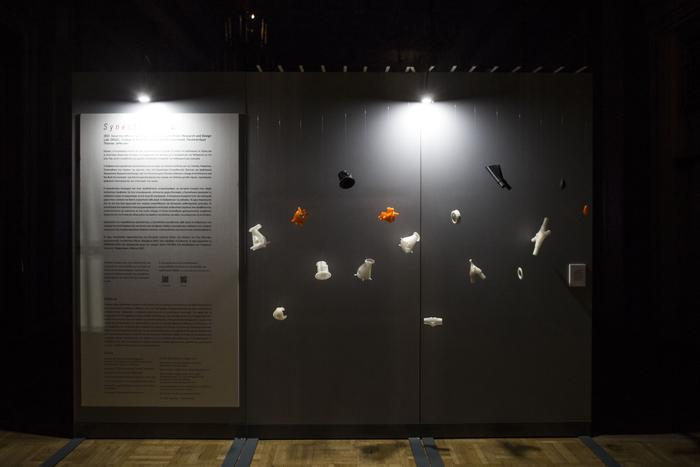 <p>Fig. 7. Entry to the installation at the Municipal Theater of Pireaus. This is the first “stage” of the overall experience in which the visitor hears <em>Synesthesia</em> without seeing it. The wall showcases a collection of the installation’s “internal organs”: structural joinery components and a sampling of the iterative process for the creation of the “eyes.” Fabricated using 3D printing technology. <span>Photo by </span><em><span>Thomas Daskalakis, </span></em><span>NDP Photo Agency.</span></p>